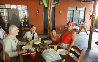 Costa Rica Sun Tours guests enjoying a home lunch with Dona Miriam