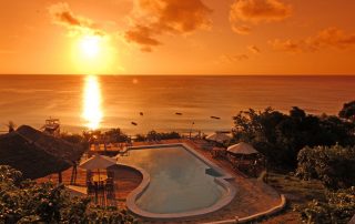 The Manta Resort pool at sunset