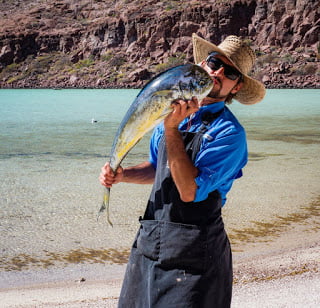 Chef Ivan with mahi mahi dinner by Mark Sissons