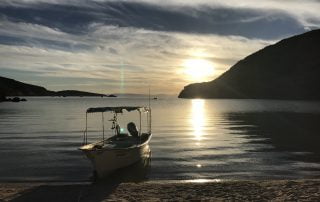 Colossus Camping boat view with Todos Santos Eco Adventures by Crystal Viks